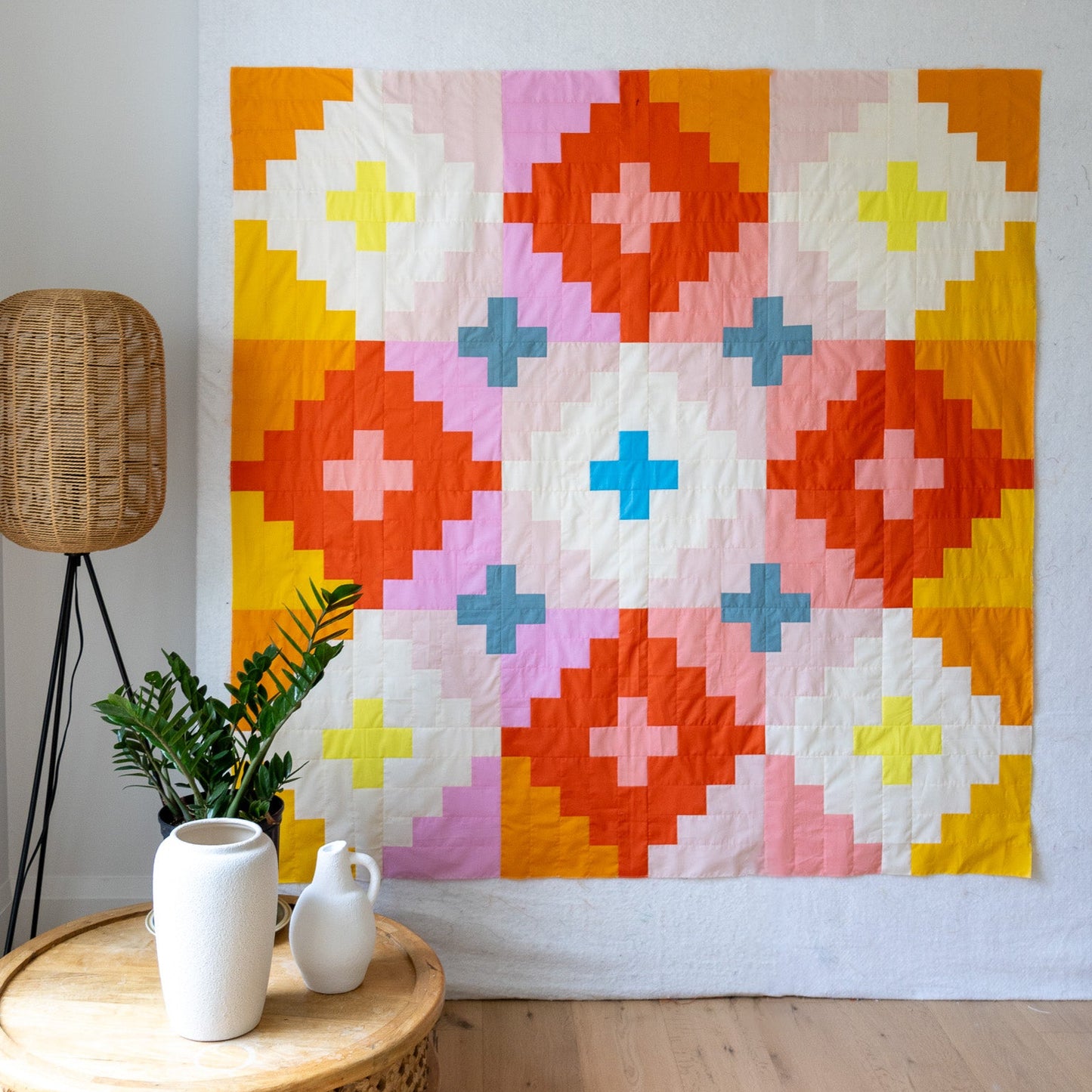 The Look Up Quilt is the latest pattern by Christine from Tessellate Textiles. This colorful quilt finishes 67 1/2" x 67 1/2".
This quilt is meant to to give “Middle-Eastern-weaver-meets-Granny-Square-Patch” vibes... she’s bright and warm and funky and not afraid to stand out a little bit.
Kit includes fabric from Heather Ross - Ruby and Bee solids. Fabric is included for top and binding. Pattern is not included.
4 1/2 yards of fabric required (sold separately) for backing.