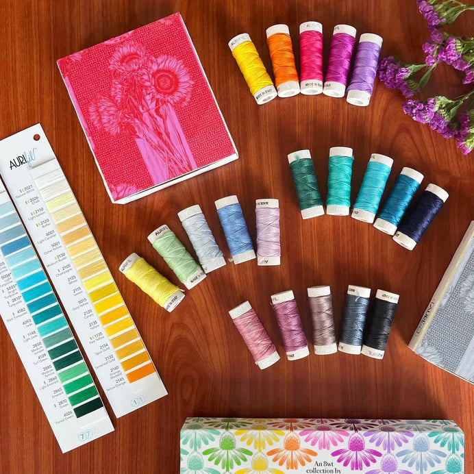 Indelible marks Aurifil’s debut collaboration with Anna Maria Textiles, a newly launched division of Northcott helmed by the esteemed designer Anna Maria Parry (formerly Horner).
This stunning new release unveils 20 fresh shades of Aurifil’s 100% Cotton 8wt thread, meticulously curated by Anna Maria. A striking array of vivid hues sit alongside essential neutrals, promising to ignite boundless creativity
This set contains one small spool of each of the following colors: 2120, 1133, 2530, 2535, 2520,