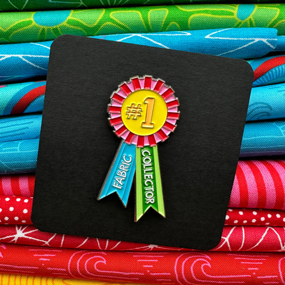 The Fabric Collector Enamel Pin is a 1st place award ribbon for Fabric Collecting, an honor we all strive for! Pin is made of zinc alloy has two rubber clutches on the back side.
Made of: Metal
Use: Enamel Pin
Size: 2in