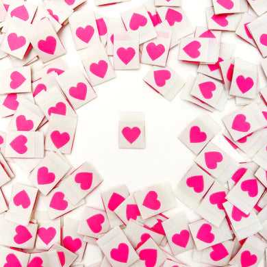 This cute little heart label was originally only available as a bonus label when purchasing items directly from the shop. Yet after receiving so many requests to purchase a pack of only these adorable pink hearts, you can now do just that! The bright pink hearts are double-sided and on a soft, cream background. They are the perfect accent for pockets, outer seams, quilts, gifts and more. They are super soft to the touch and never scratchy. The labels are fully washable and can handle the heat of the dryer.