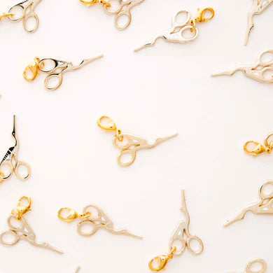 Introducing the Gold Stork Scissor Zipper Charm - the perfect accessory to elevate any zipper! This charm adds a touch of elegance and convenience to garments, bags, and keychains. Upgrade your style and functionality with this must-have charm.