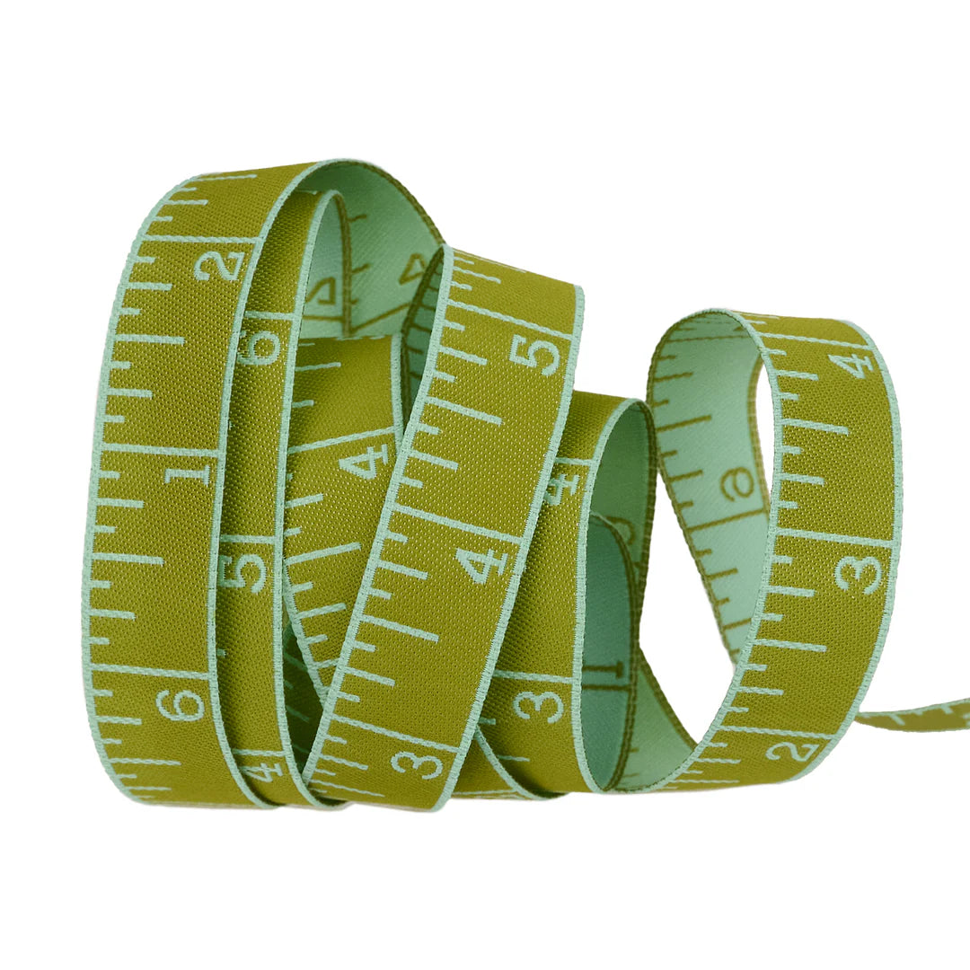 True Colors 2025 - Measure Twice in Mojito - 5/8" width - by Tula Pink
Introducing Measure Twice by designer Tula Pink! Each ribbon features a classic measuring tape design in a perfect 5/8" width, making it ideal for adding a touch of sewing charm to any project. With a rainbow of vibrant hues to choose from, these ribbons are both functional and fun—perfect for quilters, crafters, and sewing enthusiasts alike!