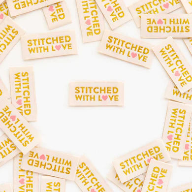 Sew a little love right into your garment, quilt or special handmade project! These high quality woven labels feature beautiful metallic gold thread and a pinky coral heart on a cream colored background. They are super soft to the touch and never scratchy. The labels are fully washable and can handle the heat of the dryer.
Sold in packs of 8 labels
Manufactured ethically in China and are OEKO-TEX Standard 100 certified