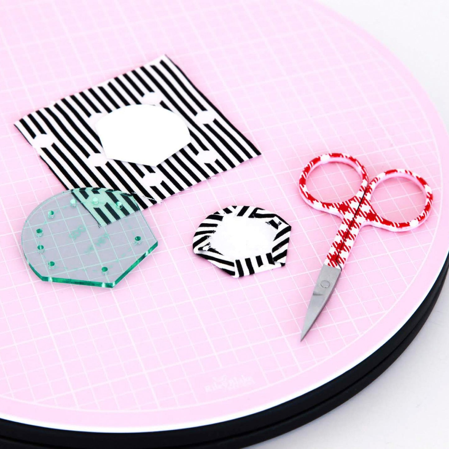 The 16" Rotating Cutting Mat by Sue Daley Designs is a must have accessory for English paper piecing and is especially useful for patchworkers on the move. With a smooth rotation, this mat is perfect for trimming up your blocks, half square triangles, cutting and gluing your English Paper Piecing shapes, auditioning your quilt blocks and is also a beautiful accessory for your sewing room. The 16" mat is self-healing, rotates 360°, and has inch grid marks.