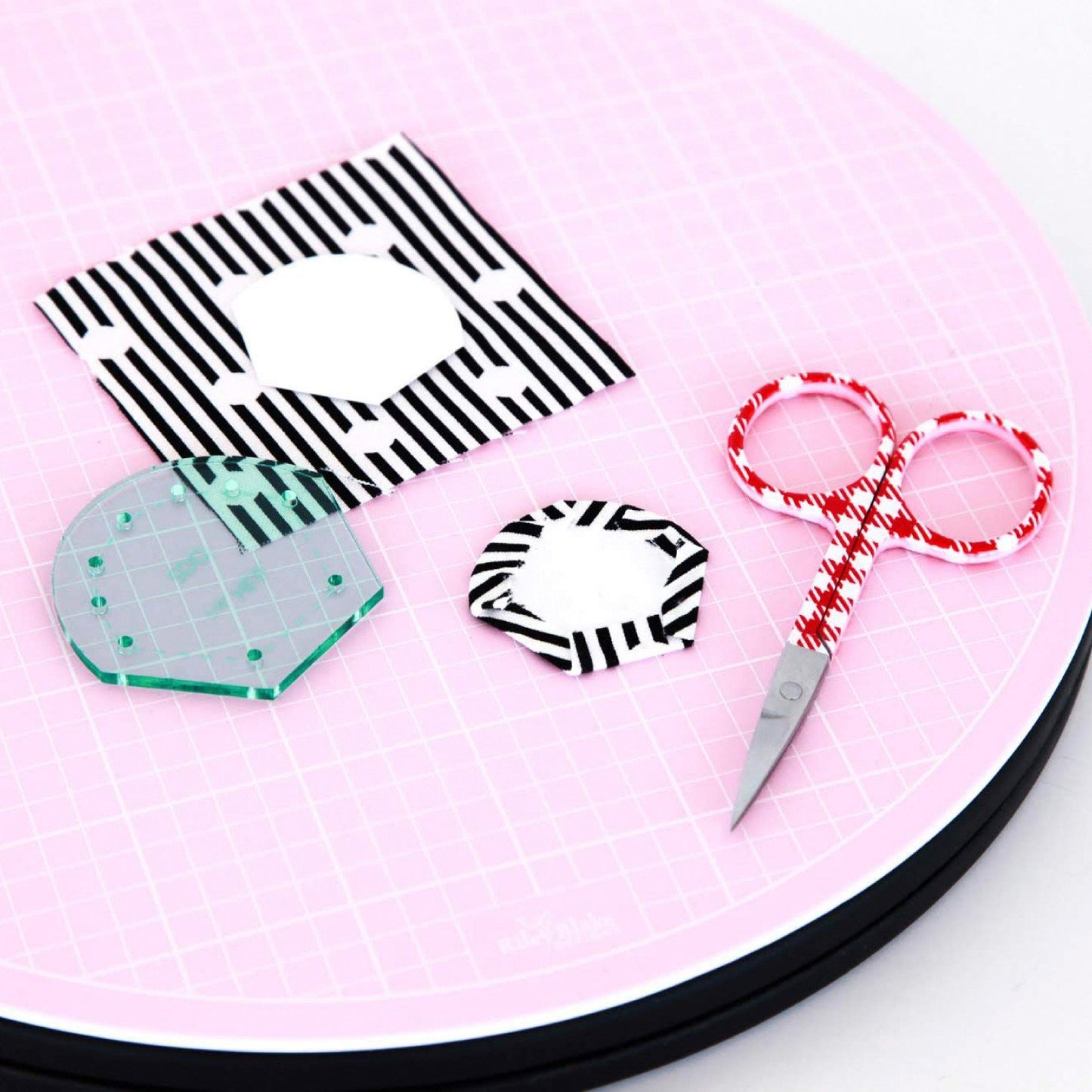 The 10" Rotating Cutting Mat by Sue Daley Designs is a must have accessory for English paper piecing and is especially useful for patchworkers on the move. With a smooth rotation, this mat is perfect for trimming up your blocks, half square triangles, cutting and gluing your English Paper Piecing shapes, auditioning your quilt blocks and is also a beautiful accessory for your sewing room. The 10" mat is self-healing, rotates 360°, and has inch grid marks.