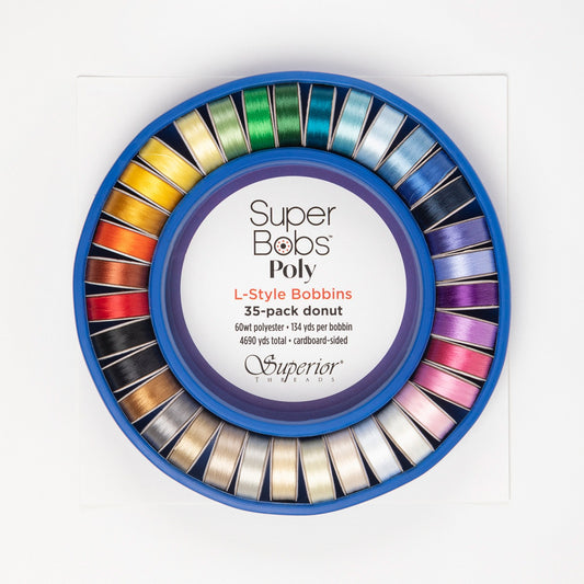 The Super Bobs Poly Donut consists of 35 unique colored, L-style pre-wound bobbins with cardboard sides, packaged in a Bobbin Saver.  Each bobbin is wound with 134 yds. of 60 wt. lint-free polyester thread for a total of 4,690 yds.  Colors: Multi Use: Bobbins Size: L-Style Length Per Bobbin: 134yds Weight: 60wt (2ply) Includes: 35 bobbins and plastic storage donut