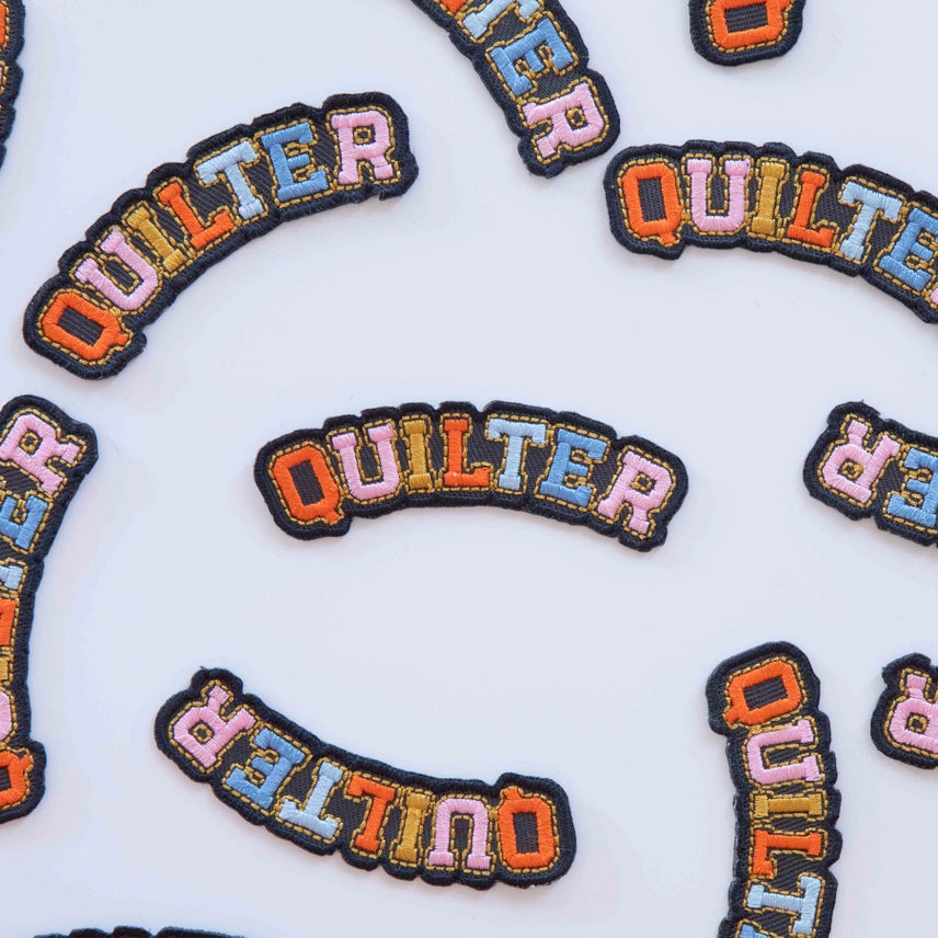 This multi-colored iron-on patch is designed for quilters who love to celebrate their craft. Perfect for tote bags, jackets, or jeans, it's an easy way to show the world you're a proud maker. Simply heat and press to apply, no sewing required.

1 iron-on patch per pack

Manufactured ethically in China and are OEKO-TEX Standard 100 certified