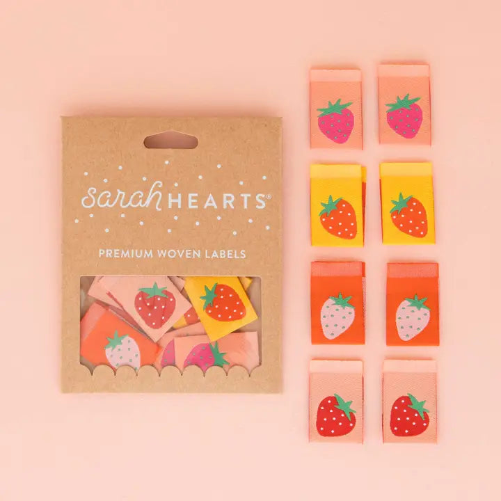 Add a sweet and charming touch to your sewing projects with our double-sided Strawberry Multipack Woven Labels. This multipack features warm colors and cute strawberry designs, perfect for adding personality to your quilts, bags, and garments.