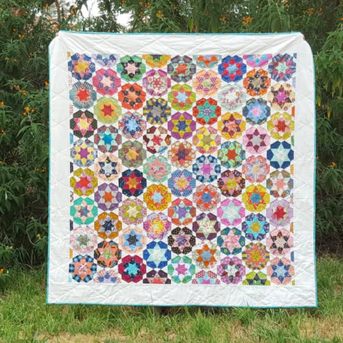 The Ice-Cream Soda Quilt by Jodi Godfrey of Tales of Cloth is such a versatile design, great for scraps, fussy cutting, all colors, or a limited palette.  Complete Piece Pack to make the entire quilt top. Pattern and Acrylic Templates are sold separately.  Finished Quilt size: 56" x 68" *Original Size Quilt* 