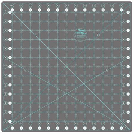 The Creative Grids rotating cutting mat makes squaring up blocks up to 14" easy and efficient.  Rotating mat is self-healing, and rotates a full 360º.  Marked with a 1" grid that includes 1/8in markings along with 45 and 60 degree angled lines.  