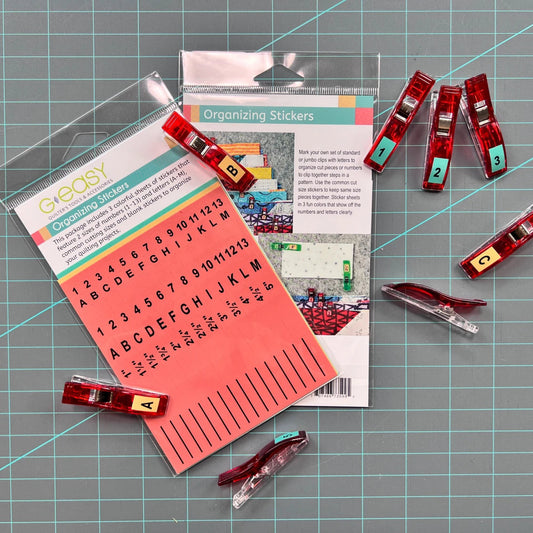 These GEasy Organizing Stickers are helpful to keep your fabric cuts organized. They are reusable and do not leave a residue behind. The stickers come with three colorful sheets that feature 2 sizes of numbers (1-13) and Letters (A-M), common cutting sizes, and blank stickers to organize your quilting projects. They are great to use on wonder clips in the regular and jumbo size.