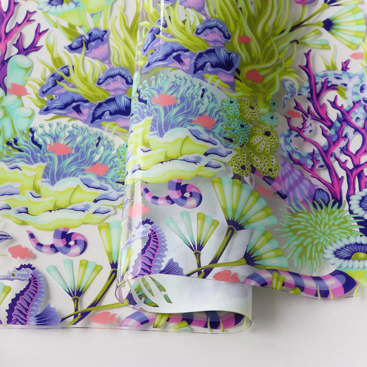 Bring a splash of underwater magic to your sewing projects with Tula Pink’s Floral Reef Collection. Each design is printed on durable, easy-to-clean TPU vinyl that’s perfect for bags, accessories, and home décor.

Reef What You Sew: A playful coral reef scene filled with whimsical sea life and hidden details.

Size: 25" width and .45mm thick