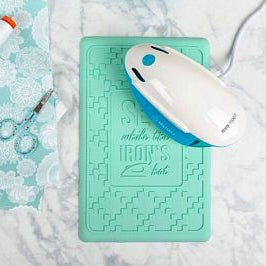 This heavy duty silicone iron rest in a minty fresh hue allows you to place your iron plate directly on the surface, so you can “press on” without it tipping over.

The generous 7” x 10.875" size will fit most home irons, and it can withstand up to 500° F (260° C).