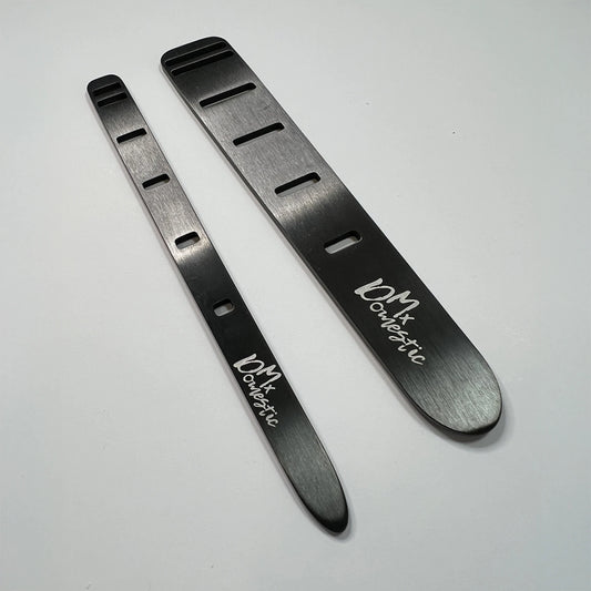 Stainless steel fabric weaving tool set designed by Mx Domestic. Includes one 1” and one 1/2” tool for fabric weaving, elastic threading, and mixed media use. Features top-loading slot system for easy grip and precision control. Set includes 2 tools with QR code for video tutorial and project inspiration.