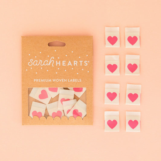 This cute little heart label was originally only available directly from Sarah Hearts retail shop. Yet after receiving so many requests from stockists, this label is now available! The bright pink hearts are double-sided and on a soft, cream background. They are the perfect accent for pockets, outer seams, quilts, gifts and more. They are super soft to the touch and never scratchy. 
