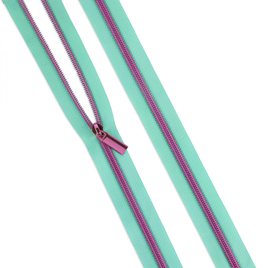 #5 Zippers by the Yard contain 3 yards of Zipper Tape with Nylon Teeth and 9 matching pulls. Coordinate the zipper tape color with your fabric and match the zipper teeth color with your purse hardware! Easily cut and sew through the nylon teeth while achieving the appearance of metal teeth.  Color: Green / Pink