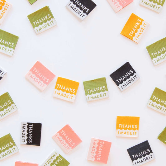 Add some color to your handmade garments, bags, and quilts with an updated version of our best selling Thanks I Made It Woven Labels. Featuring playful shades of mustard, olive, coral, and black, these soft-to-the-touch labels are designed to last through machine washing cold and tumble drying on low. Give your creations a fun, colorful finish that celebrates your craft with every stitch!

Sold in packs of 8 labels, 3cm x 2.8cm

Manufactured ethically in China and are OEKO-TEX Standard 100 certified