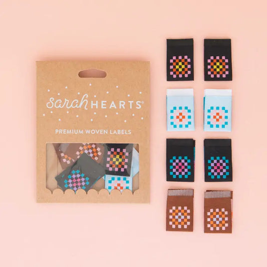 Add a personal touch to your handmade projects with our Granny Square Multipack Woven Labels. These sew-on labels feature retro vibes and are perfect for quilts, crochet items, bags and more. Make your creations stand out with our unique granny square design!