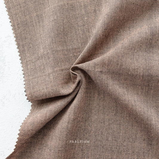 Manufacturer: Fableism Supply Co. Designer: Fableism Supply Co. Collection: Everyday Chambray: Nocturne Print Name: Sepia Material: 52% Cotton/48% Bamboo SKU: ECW-NOC-01-SEPIA Width: 44 inches