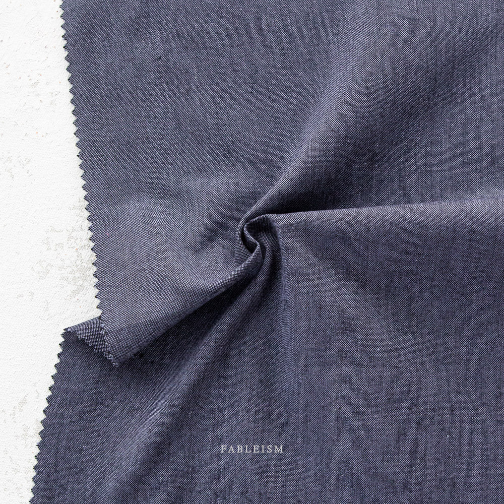 Manufacturer: Fableism Supply Co. Designer: Fableism Supply Co. Collection: Everyday Chambray: Nocturne Print Name: Galaxy Material: 52% Cotton/48% Bamboo SKU: ECW-NOC-01-GALAXY Width: 44 inches