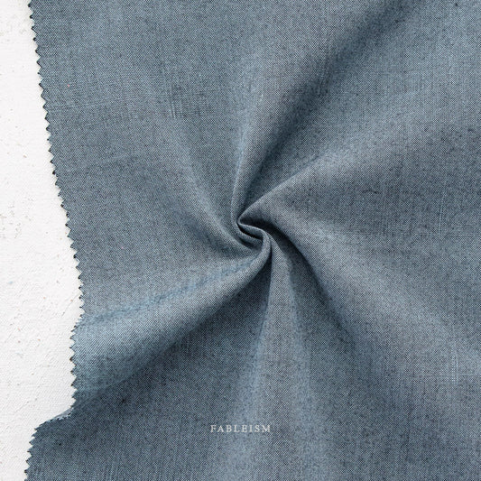 Manufacturer: Fableism Supply Co. Designer: Fableism Supply Co. Collection: Everyday Chambray: Nocturne Print Name: Luna Material: 52% Cotton/48% Bamboo SKU: ECW-NOC-01-LUNA Width: 44 inches