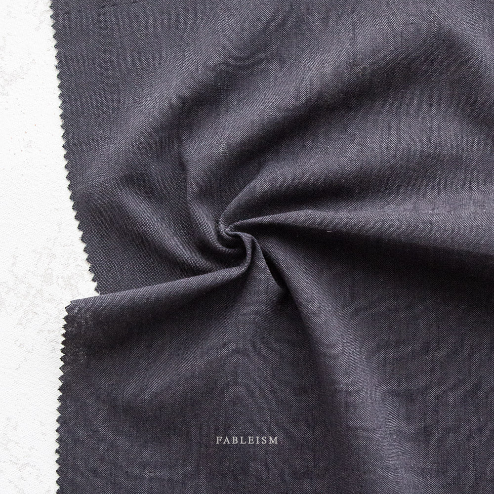 Manufacturer: Fableism Supply Co. Designer: Fableism Supply Co. Collection: Everyday Chambray: Nocturne Print Name: Gravity Material: 52% Cotton/48% Bamboo SKU: ECW-NOC-01-GRAVITY Width: 44 inches