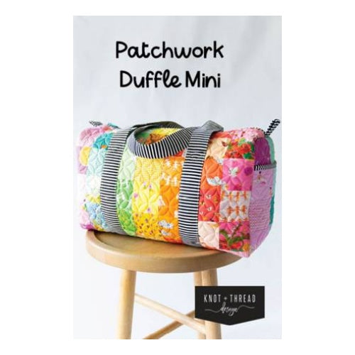 If you liked the wildly popular Patchwork Duffle you'll love to have the mini version of it! This Duffle features a patchwork exterior (or make it with your favorite fabric in a one fabric version) and large spacious opening. Perfect for all your travel needs! Size: 10'' H 17.5''W x 8.5'' D  Printed Paper Pattern Finished Size: 10in x 17-1/2in x 8-1/2in Final Product: Bags / Purses / Totes Etc. Paper Templates Included Technique Used: Standard Machine Sewing Skill Level: Beginner